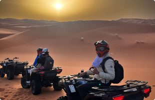 Tourists on a quad bike in Merzouga desert
